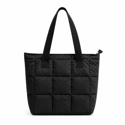 Black quilted tote bag on a white background