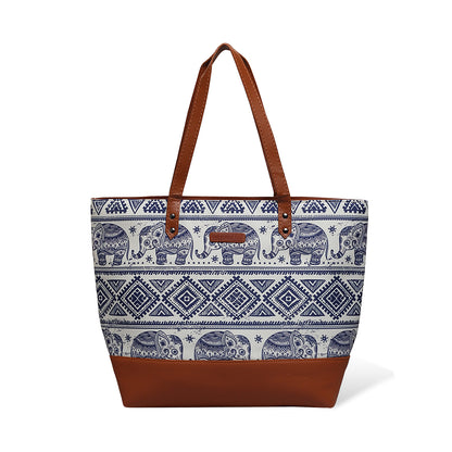 Chic leather tote bag with elephant print and brown handle.