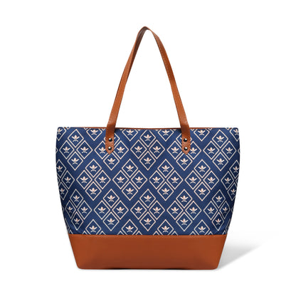 Tote bag in blue and brown hues by a wooden chair