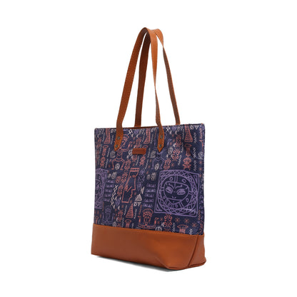 A stylish purple and brown tote bag resting on a chair, perfect for carrying your essentials.