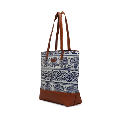 Elephant print tote bag crafted from leather with brown handle.