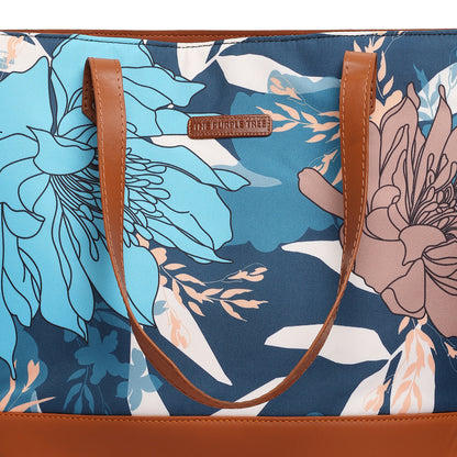  A floral bag resting on a chair beside a window, adding a touch of elegance to the room decor.