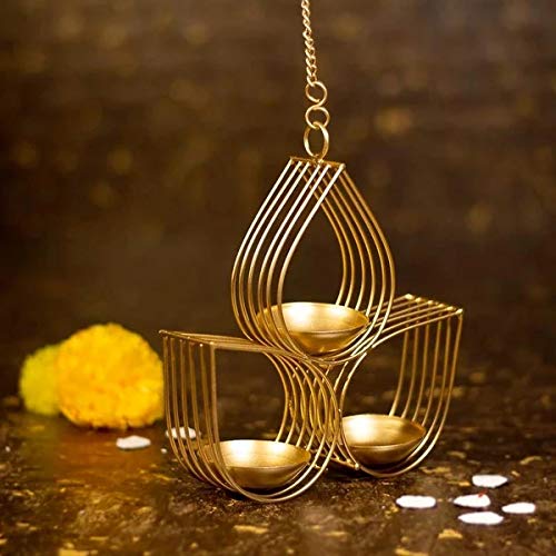 Decorative gold hanging lamp with three candle holders on a dark background