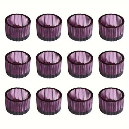 Set of 12 purple candle holders with ribbed design on a white background
