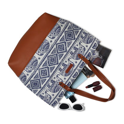Stylish tote bag featuring elephant print and brown handle.