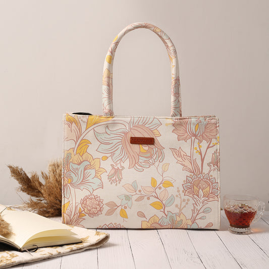  White and yellow floral print tote bag, perfect for spring outings.