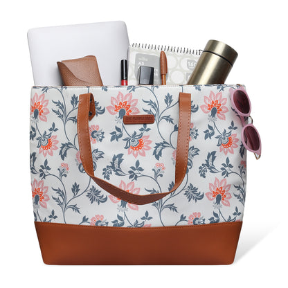2. Stylish leather tote bag with floral design and brown handle.