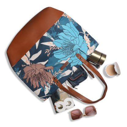 A chair holding a colorful floral bag.