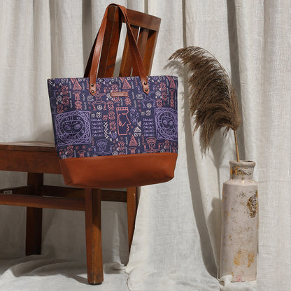 Purple and brown tote bag casually placed on a chair.