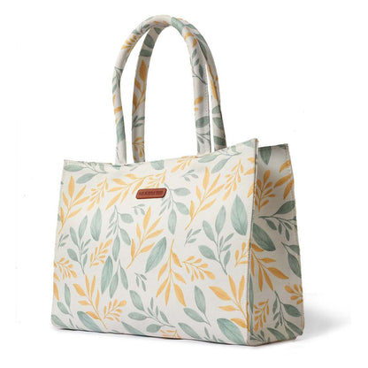 Eye-catching tote bag with a unique yellow and green leaf design.