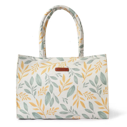 Stylish tote bag featuring a vibrant yellow and green leaf pattern.