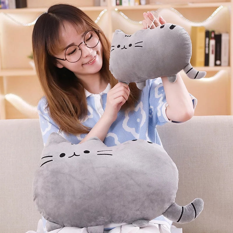  Colorful Saturn-shaped pillow in pink and blue stripes.
