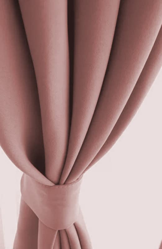 Elegant pink curtain with a charming bow accent.