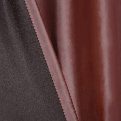 curtain hanging next to a white vase.