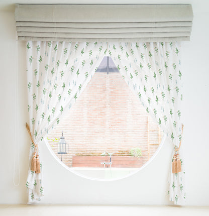  Enhance your home decor with a curtain showcasing a beautiful green leaf and flower motif.