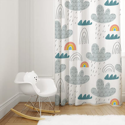 White curtain adorned with rainbows and fluffy clouds.