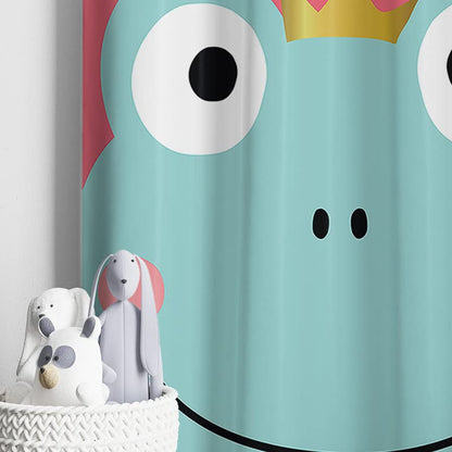 A cute cartoon frog wearing a crown, dangling from a curtain.