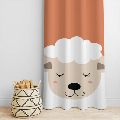 A sleeping sheep on an orange and white curtain.