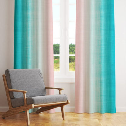 Pink and blue curtain hanging against a white wall.