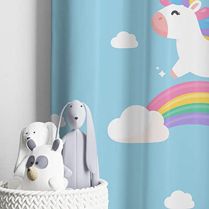 Blue curtain backdrop with unicorn in flight.