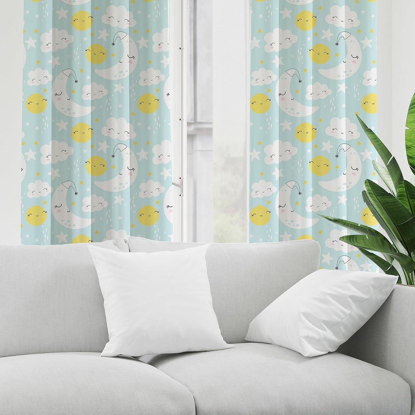 Blue and yellow curtain featuring playful sun, moon, and clouds.