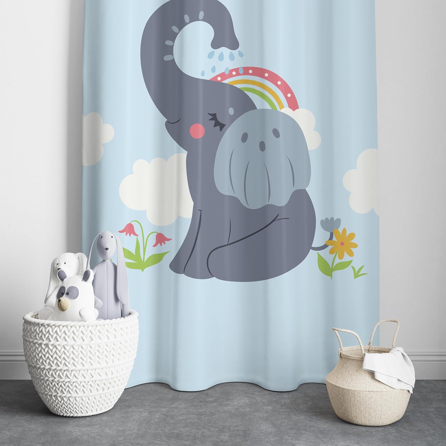 A colorful curtain featuring a playful elephant under a vibrant rainbow.