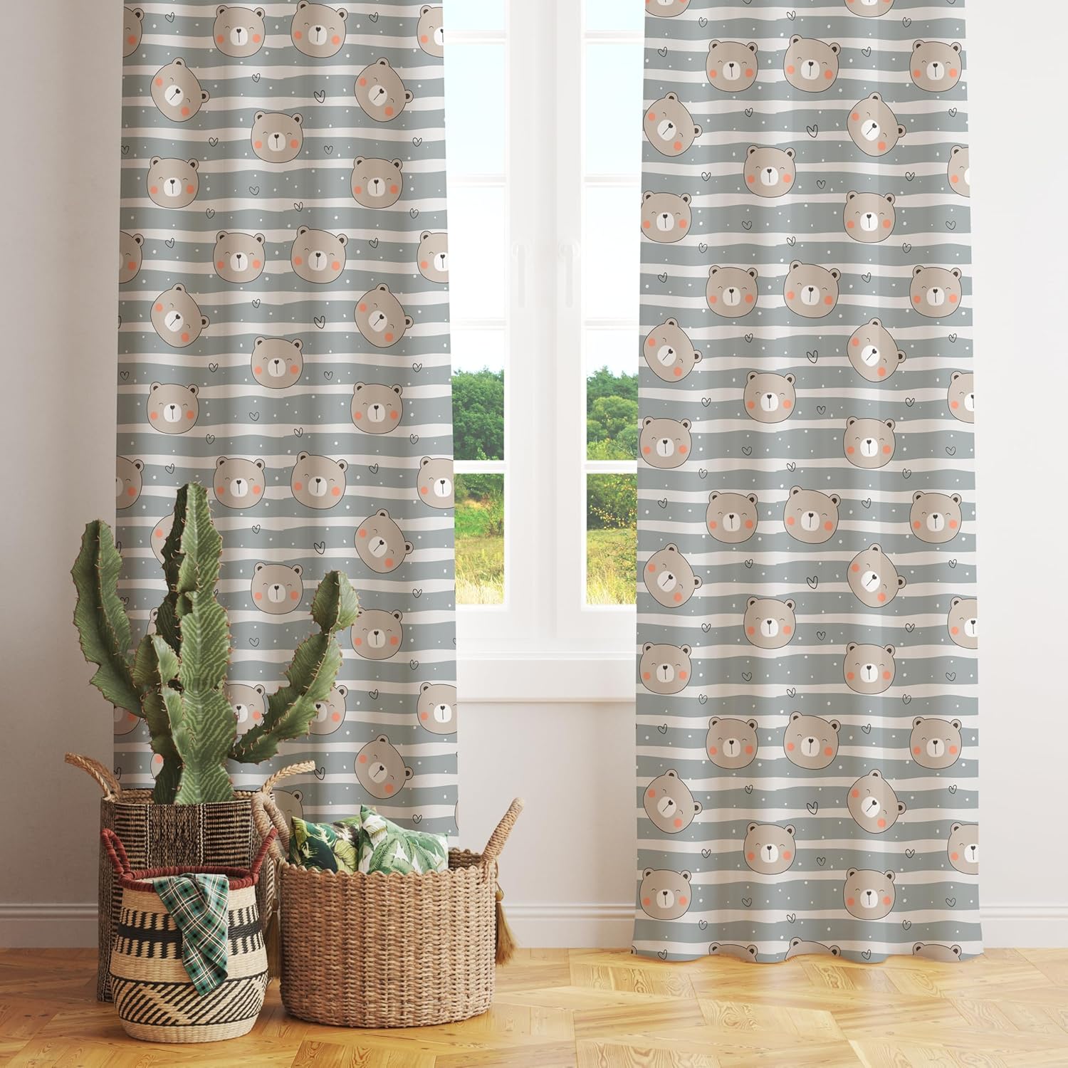 A curtain with grey and white stripes adorned with a whimsical bear design.
