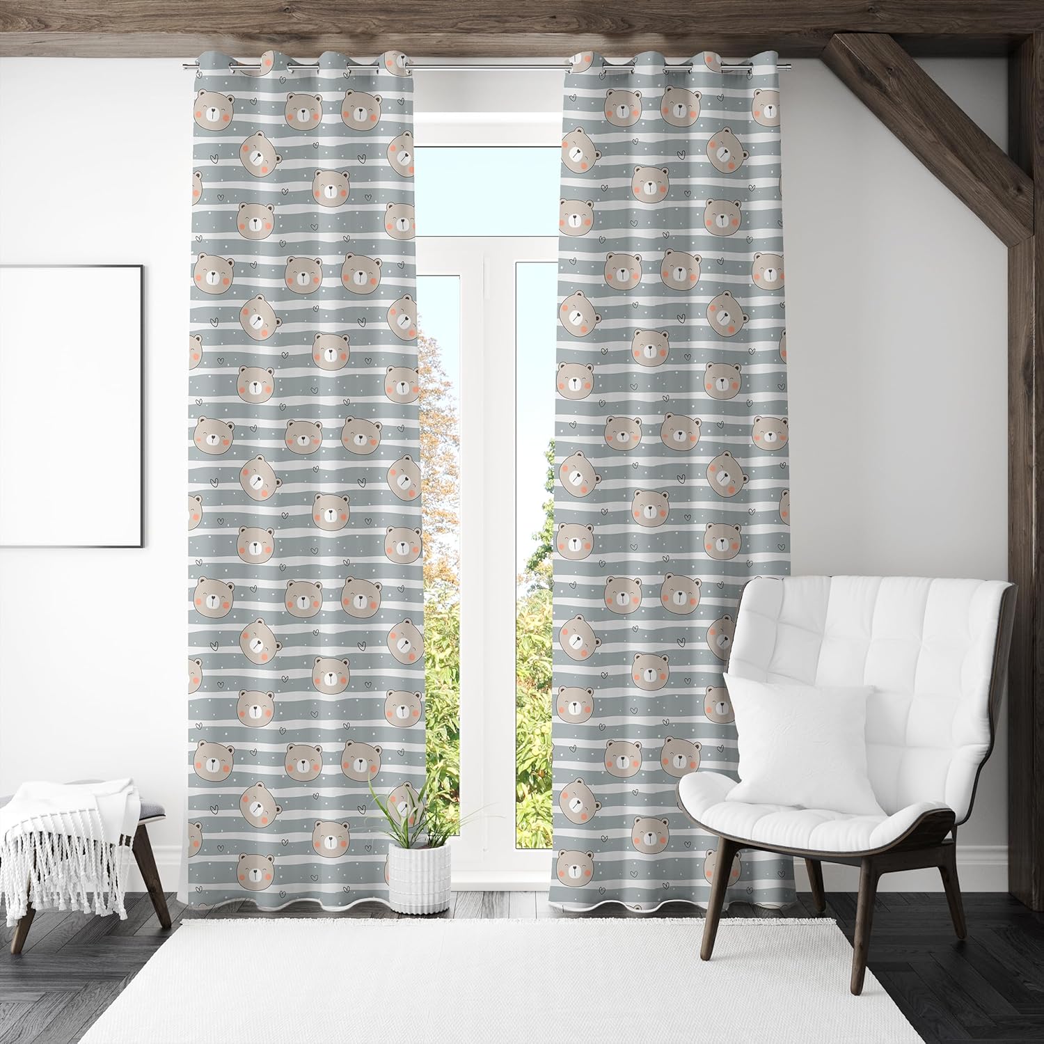A curtain displaying grey and white stripes with a bear pattern integrated into the design.