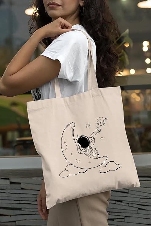 Women Handling Astronaut & Moon print cotton tote bag