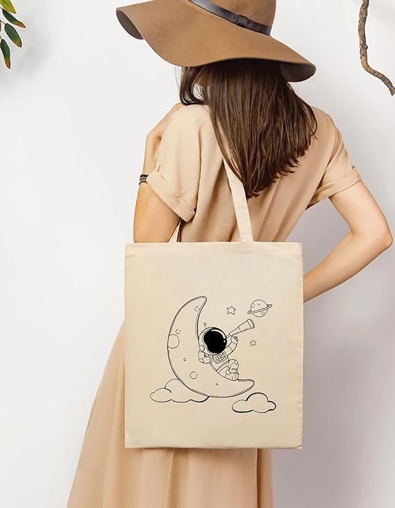 Women Carrying Astronaut & Moon print cotton tote bag