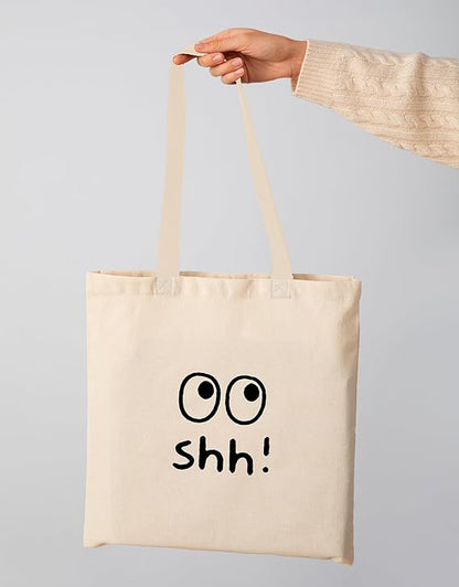 Rolling eye print on cotton duck tote bag on hand