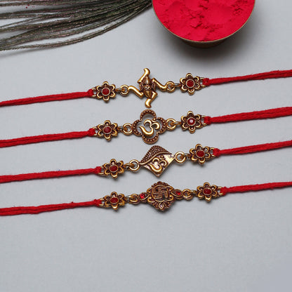 Set of 4 red rakhi with gold charms, traditional design.