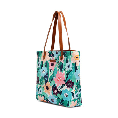 Elegant tote bag with a floral print and leather handle.