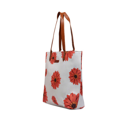 Fluffy ginger cat sitting by the window, watching the world outside intently.