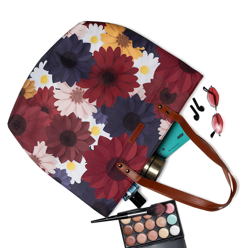 Chic tote bag featuring a bold floral print, ideal for adding a pop of color to your outfit.