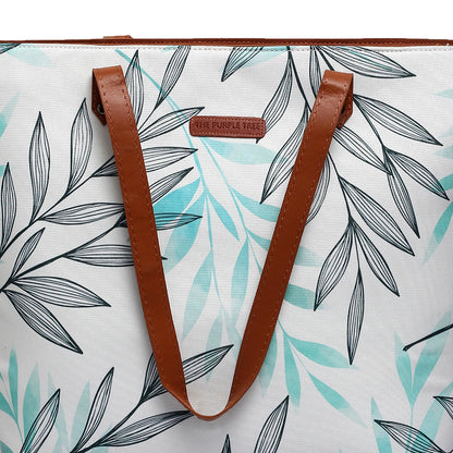 Stay on-trend with this white and green leaf print tote bag, a must-have accessory.
