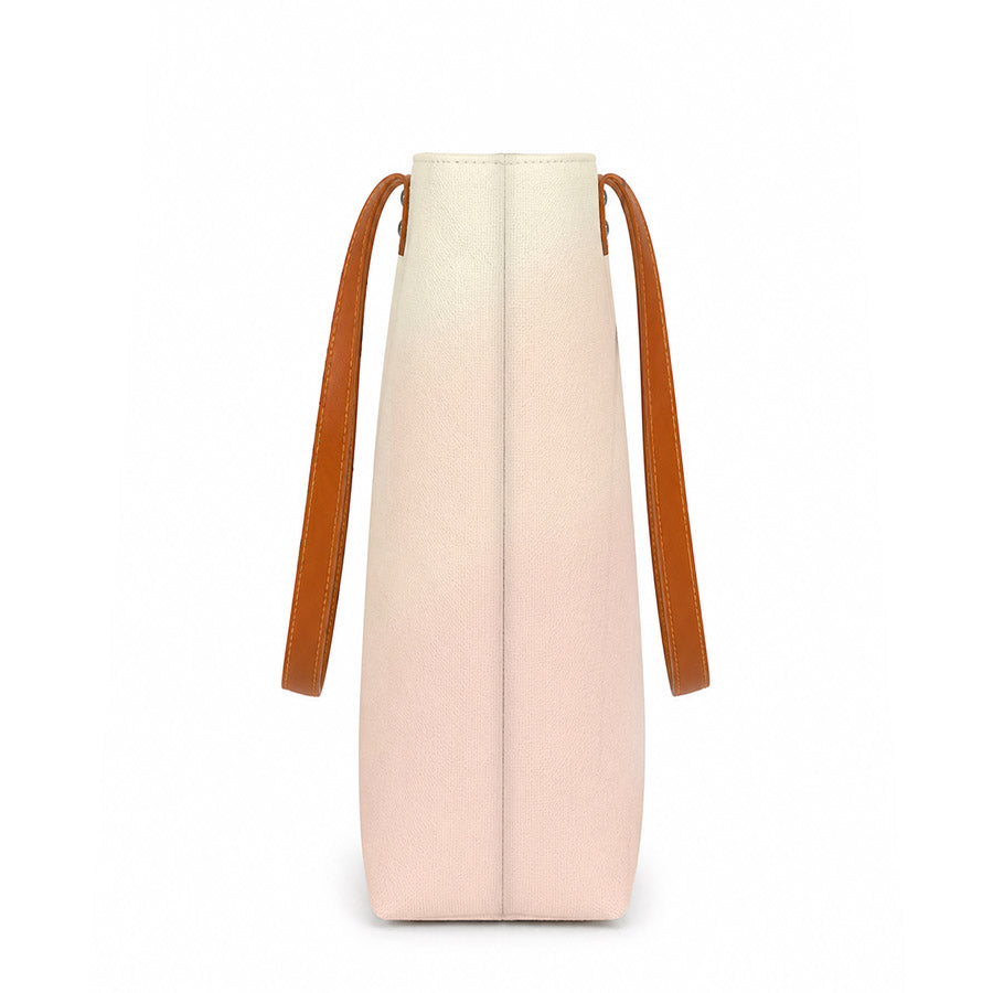 Pink and beige bag with brown straps on a white background