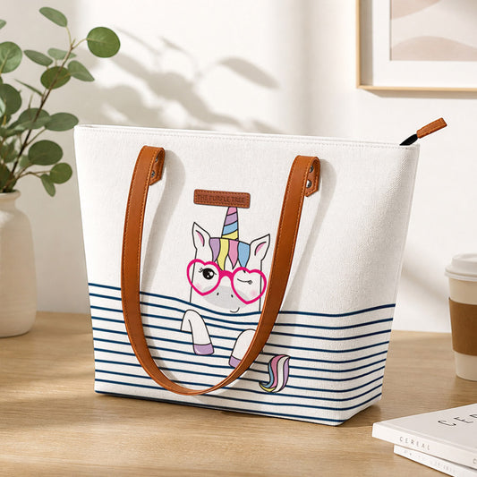 White tote bag featuring a stylish unicorn with glasses, perfect for adding a touch of whimsy to your outfit.