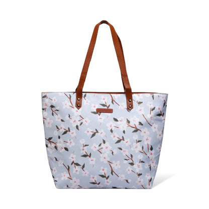 Chic tote bag adorned with floral print and crafted with leather handles.