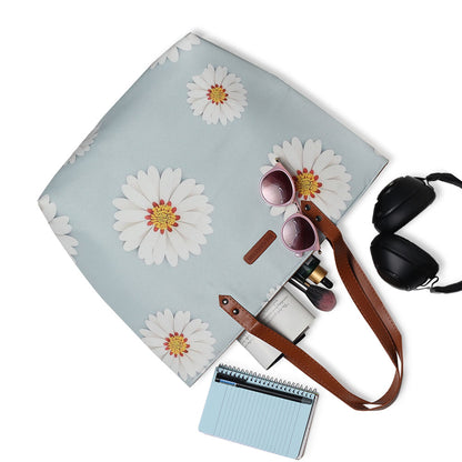 Stay chic with this spacious tote bag adorned with white daisies, a must-have accessory for any flower lover.