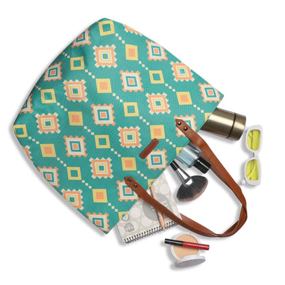 Vibrant green and yellow tribal print tote bag, ideal for a stylish and unique accessory.