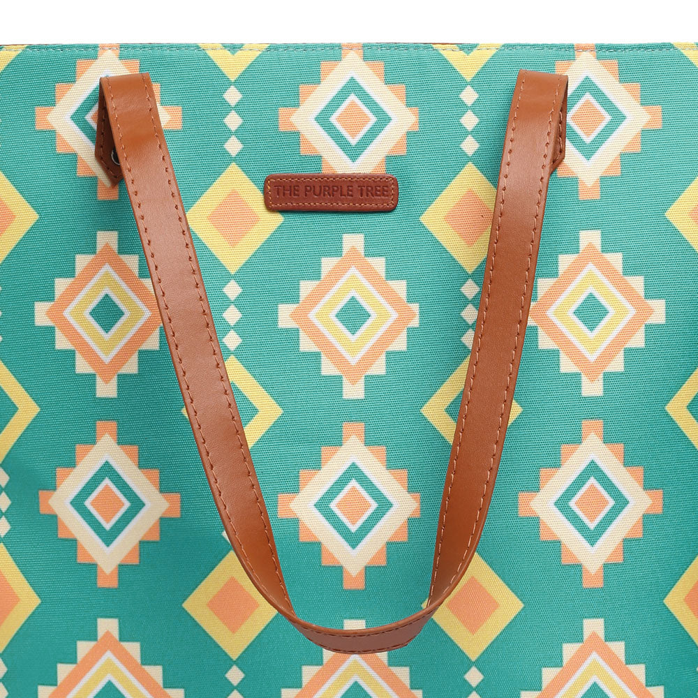 Chic green and yellow tribal pattern tote bag, a must-have accessory for a fashion-forward look.