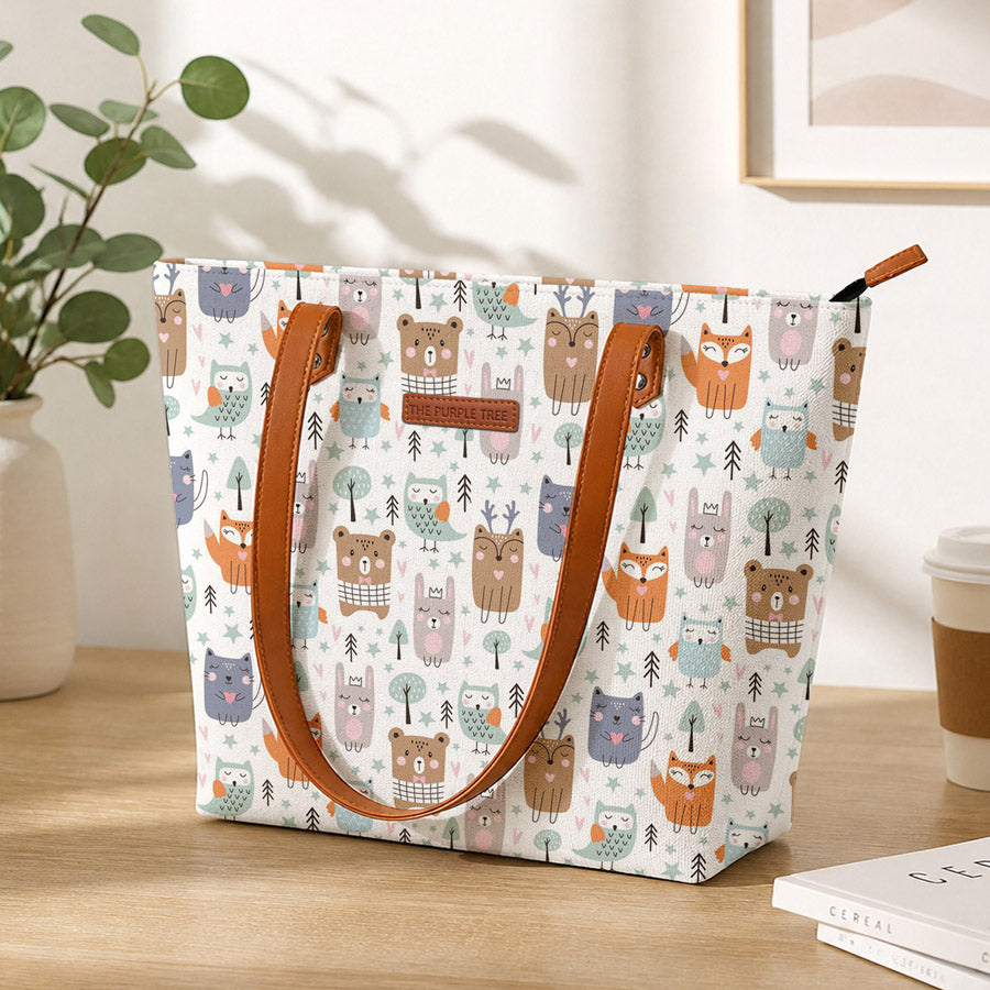 A white tote bag adorned with a delightful pattern of adorable animals. Perfect for animal lovers!