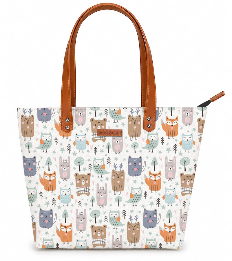 A white tote bag adorned with a delightful pattern of adorable animals. Perfect for animal lovers!