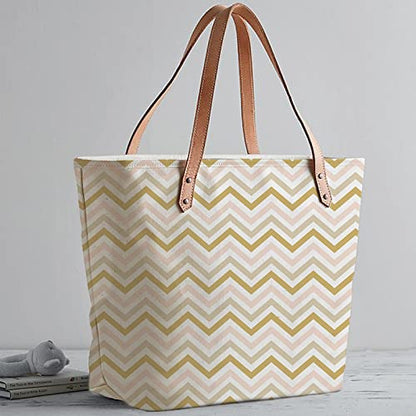 Chic tote bag featuring a trendy pink and gold chevron pattern, ideal for a fashion-forward look.