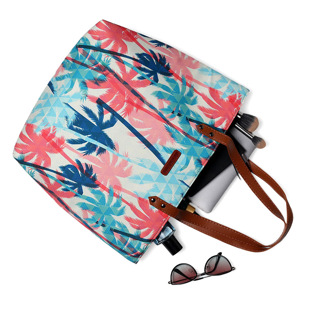 Colorful palm tree print tote bag, perfect for a day at the beach or a tropical getaway.