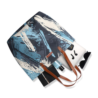 Stylish tote bag in blue and white with a fun paint brush design, ideal for art enthusiasts.