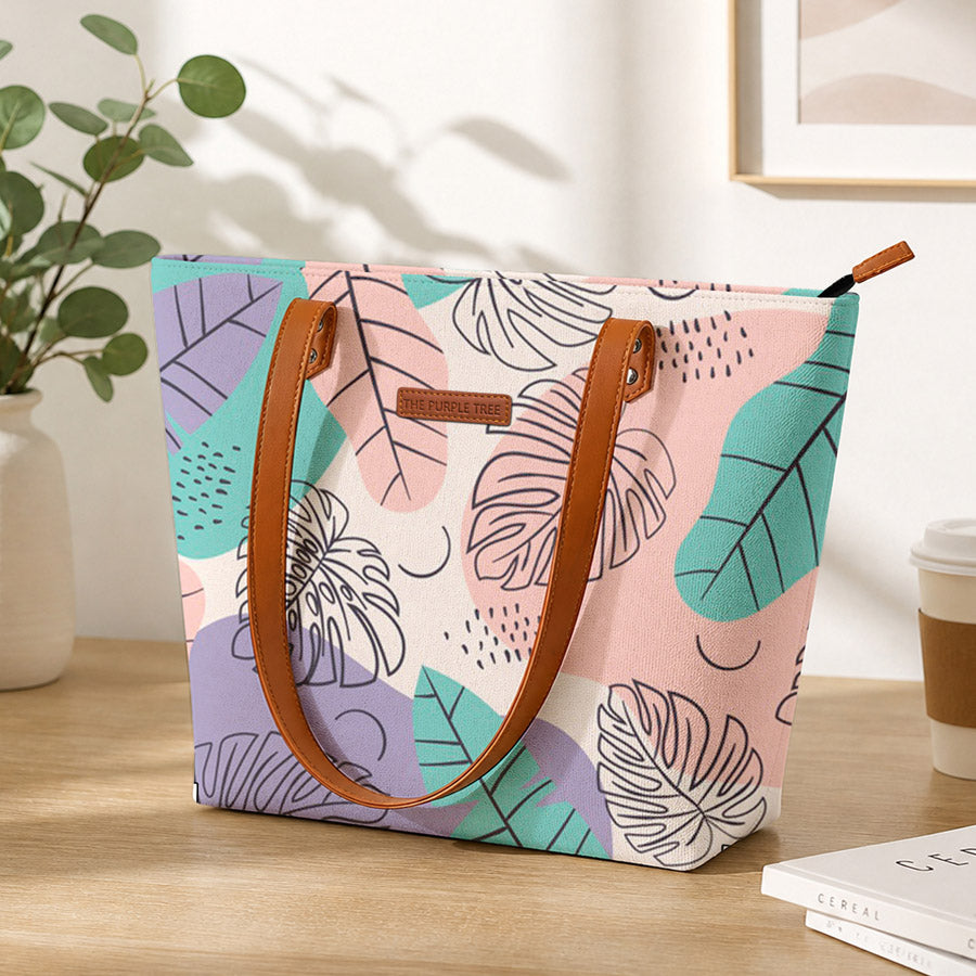 Colorful tote bag with leaf pattern on a wooden surface