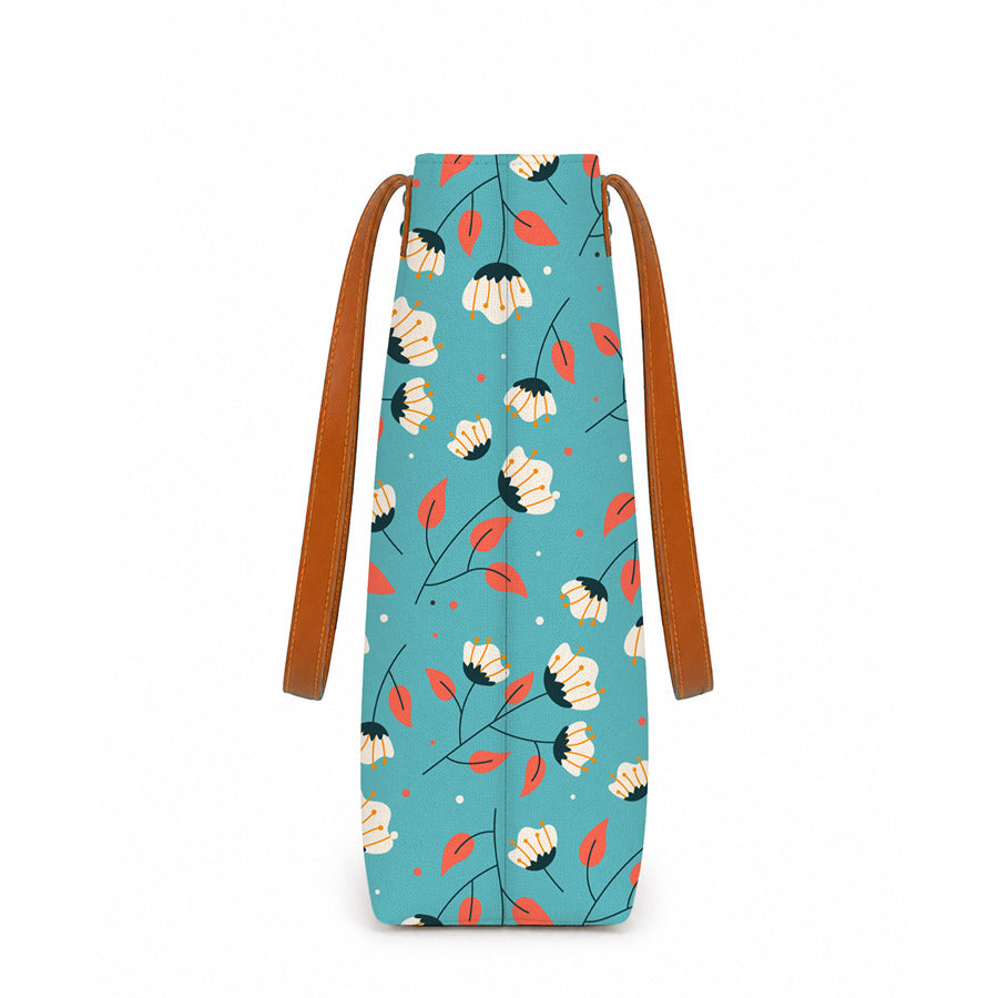 Floral-patterned bag with brown straps on a white background