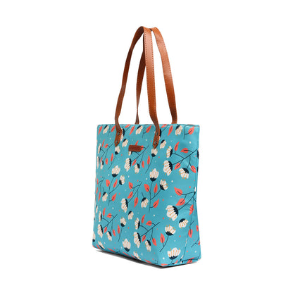  Blue and white floral print tote bag, perfect for carrying essentials on a sunny day out.